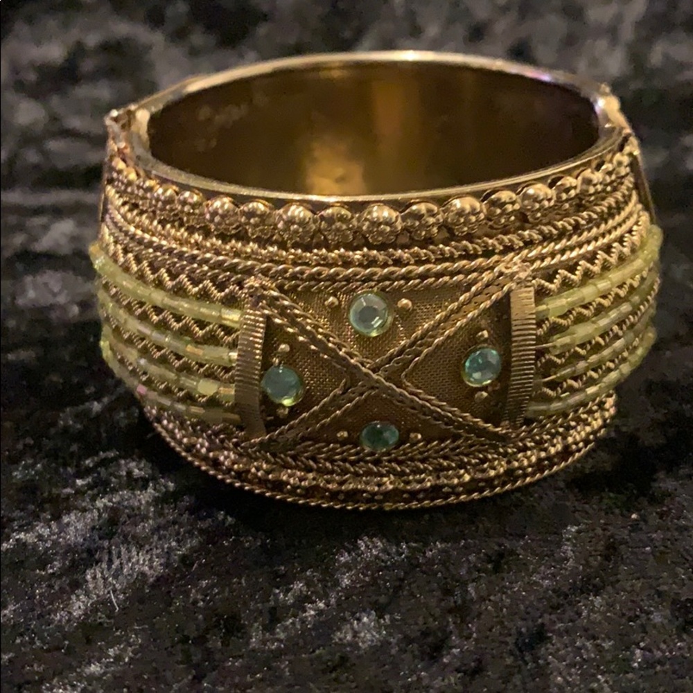 Womans brass bracelet w/ olive green pearl accent